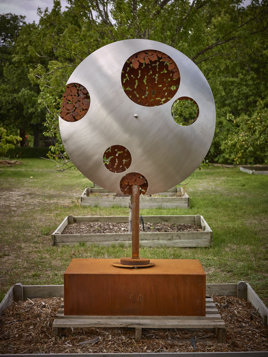 1.2m diameter, 2m tall, two sided corten steel/stainless steel on swivel with exterior LED lighting (side 1)