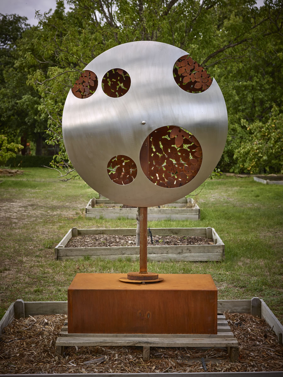 1.2m diameter, 2m tall, two sided corten steel/stainless steel on swivel with exterior LED lighting (side 1)