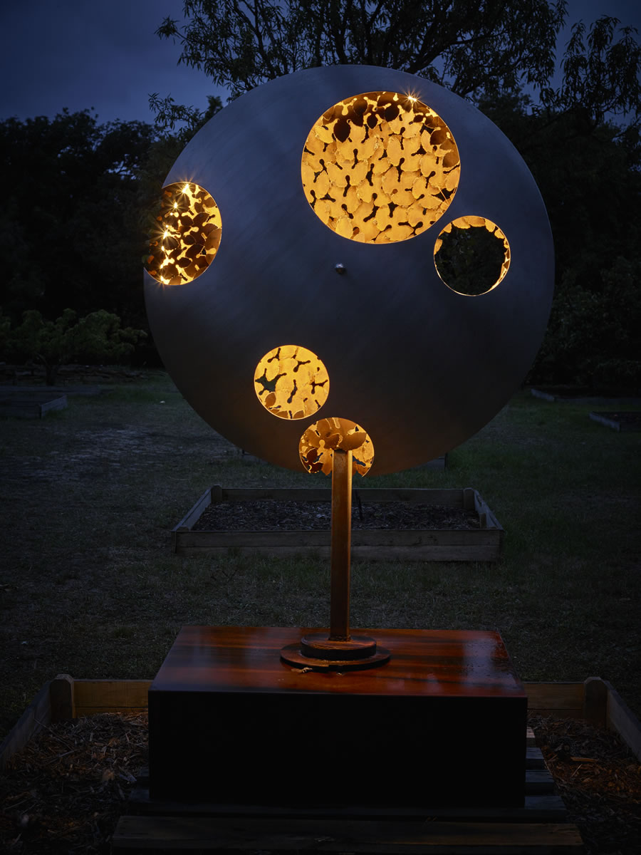 1.2m diameter, 2m tall, two sided corten steel/stainless steel on swivel with exterior LED lighting (side 1)