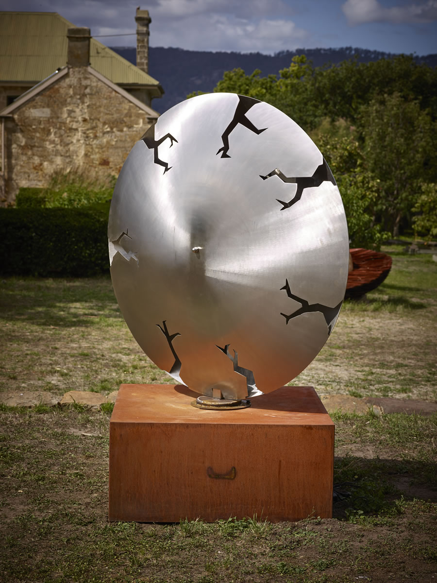 1.5m diameter, two sided stainless steel/corten steel/gold on swivel with exterior LED lighting (side 1)