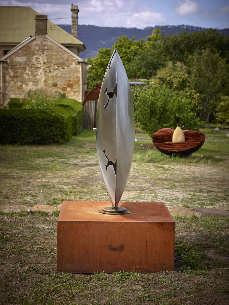 1.5m diameter, two sided stainless steel/corten steel/gold on swivel with exterior LED lighting (side view)