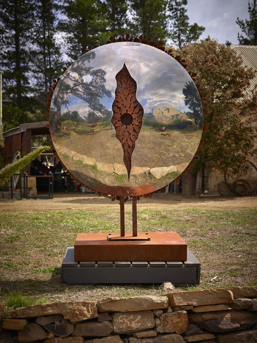 1.6m diameter, two sided corten steel/mirror stainless steel with exterior LED lighting (side 1)