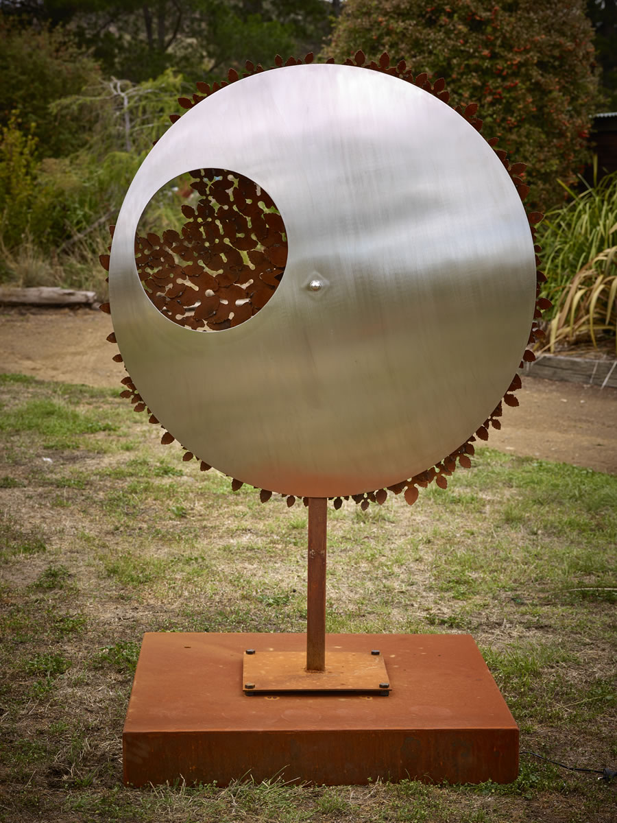 1.2m diameter, 2m tall, two sided corten/stainless steel with exterior LED lighting (side 1)